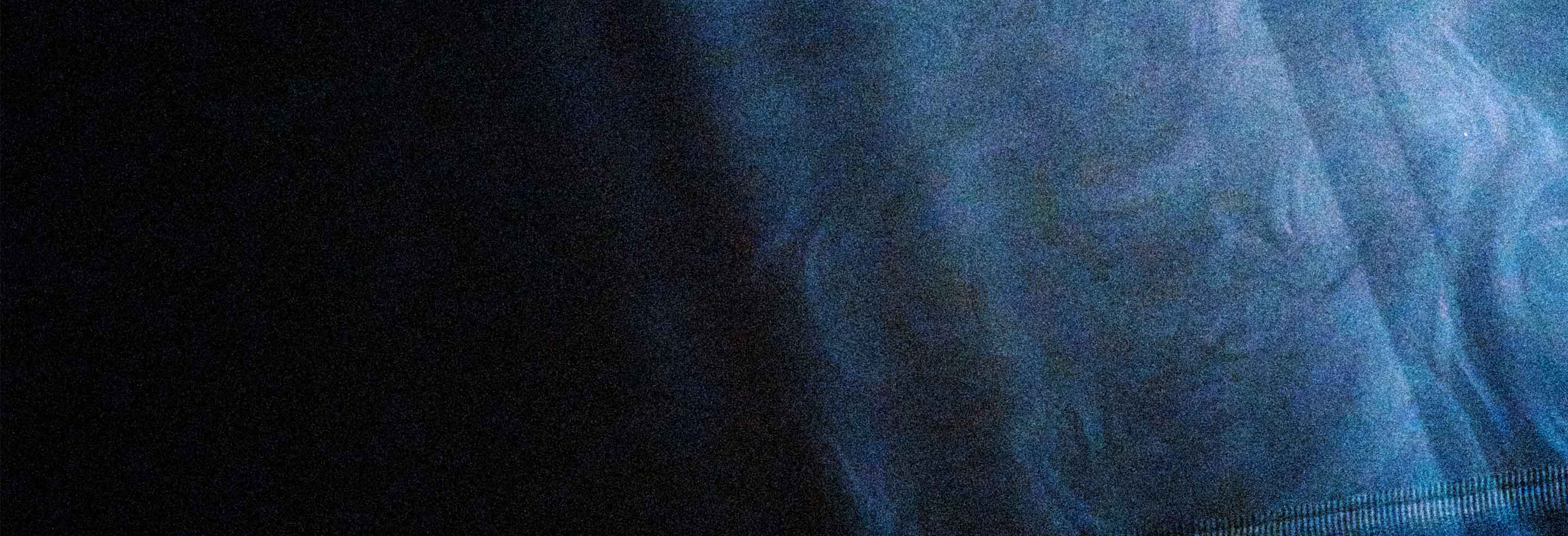 A dark blue textured backdrop