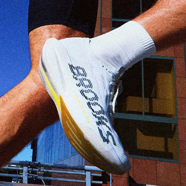 A closeup of a man wearing running shoes
